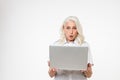 Portrait of a shocked mature woman looking at laptop Royalty Free Stock Photo