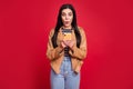 Portrait of shocked person staring phone screen open mouth isolated on bright yellow color background