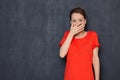 Portrait of shocked scared young woman covering mouth with hand Royalty Free Stock Photo
