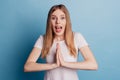 Portrait of shocked surprised lady plead open mouth wear white t-shirt isolated on blue color background