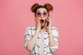 Portrait of a shocked young girl talking on mobile phone Royalty Free Stock Photo