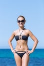 Portrait of short-haired smiling blond woman in black swimsuit Royalty Free Stock Photo