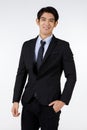 Portrait shot of Asian young black short hair smart confident businessman entrepreneur in formal suit with necktie standing Royalty Free Stock Photo