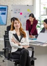 Portrait shot Asian young happy cheerful confident millennial professional successful female businesswoman in formal suit sitting Royalty Free Stock Photo