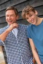 Happy Laughing Middle Aged Father and Teenager Son Royalty Free Stock Photo