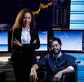 Portrait shot of Caucasian bearded male businessman broker sitting on wheelchair with African American female businesswoman Royalty Free Stock Photo