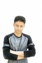 Portrait shot of a Caucasian teenager wearing a black colored full sleeves t-shirt and expressing doubtfulness on his face.Isolate Royalty Free Stock Photo