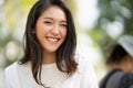 Portrait shot of happy, successful, attractive bearded of Asian woman with big smiling with a confident look toward the camera at