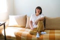 Portrait shot in head of peaceful calm middle aged woman relaxing on cozy sofa Royalty Free Stock Photo