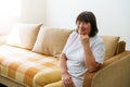 Portrait shot in head of peaceful calm middle aged woman relaxing on cozy sofa Royalty Free Stock Photo