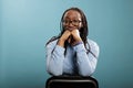 Portrait shot of joyful confident adult person wearing glasses while looking at camera Royalty Free Stock Photo