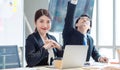 Portrait shot of Millennial Asian young professional successful female businesswoman in formal suit sitting smiling posing look at Royalty Free Stock Photo