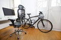 PC, Desk and Bicycle inside an office
