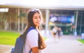 Portrait shot of young Asian female student smiling outdoor Royalty Free Stock Photo