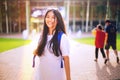 Portrait shot of young Asian female student smiling outdoor Royalty Free Stock Photo