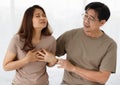 Portrait shot of senior Asian lover couple wearing eyeglasses. Wife suffering from cardiac chest pain caused by her cardiovascular Royalty Free Stock Photo