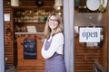 Smiling middle aged woman standing in the cafe while reopening after pandemia Royalty Free Stock Photo