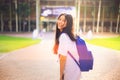 Portrait shot of young Asian female student smiling outdoor Royalty Free Stock Photo