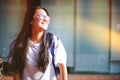 Portrait shot of young Asian female student smiling outdoor Royalty Free Stock Photo