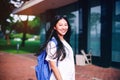 Portrait shot of young Asian female student smiling outdoor Royalty Free Stock Photo