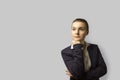 Portrait shot. young beautiful business woman with short hair combed back, wearing a jacket. with a serious face