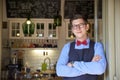 Small business owner standing in the cafe entrance while wating for guest Royalty Free Stock Photo