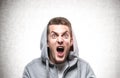 Yelling young man in hoodie Royalty Free Stock Photo