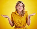 Portrait, shrug and woman with a smile, confused and decision with lady against studio background. Face, female model