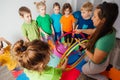 Shy boy learning to interact with kids at daycare