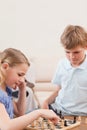 Portrait of siblings playing chess Royalty Free Stock Photo