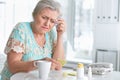 Portrait of sick beautiful senior woman with headache Royalty Free Stock Photo