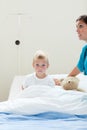 Portrait of a sick little boy on a hospital bed Royalty Free Stock Photo