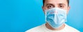 Portrait of a sick man wearing medical mask with infection text at blue background. Coronavirus concept. Protect your health Royalty Free Stock Photo