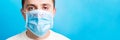 Portrait of a sick man wearing medical mask with MERS text at blue background. Coronavirus concept. Protect your health banner