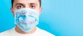 Portrait of a sick man wearing medical mask with what is coronavirus text at blue background. Coronavirus concept. Protect your Royalty Free Stock Photo