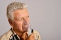 Portrait of sick old man with inhaler Royalty Free Stock Photo