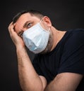 Sick old man in medical mask