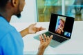 Portrait of a sick patient coughing into tissue being helped via tele medicin