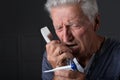 Portrait of a sick senior man calling to hospital Royalty Free Stock Photo