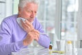 Portrait of sick senior man with pills posing Royalty Free Stock Photo