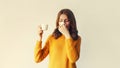 Portrait of sick upset woman sneezing blow nose using tissue and holding mug of hot coffee or drink