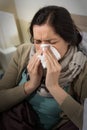 Portrait of sick woman blowing her nose Royalty Free Stock Photo