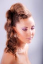 portrait sideview of blonde girl in elegant whimsical coiffure