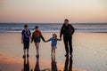 Portrait silhouettes of three children and dad happy kids with father on beach at sunset. happy family, Man, two school Royalty Free Stock Photo