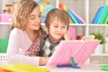 Portrait of a sister helping her brother with homework Royalty Free Stock Photo