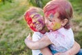 Portrait of the sisters, painted in the colors of Holi.