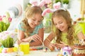 Portrait of sisters preparing for Easter in the kitchen