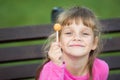 Portrait of a six-year-old cheerful girl who holds a lollipop in her hand Royalty Free Stock Photo