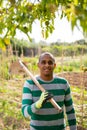 Skillful Colombian gardener with hoe at smallholding Royalty Free Stock Photo