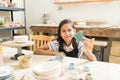 Girl Showing Clay Butterfly Painted By Her In Pottery Class Royalty Free Stock Photo